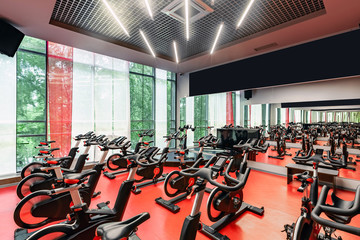 Stationary Spinning bicycles. Indoor cycling for lifestyle design. Fitness background. Healthy...