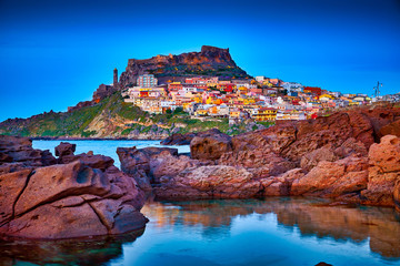 Beautiful panoramic view of Medieval town of Castelsardo, Province of Sassari, Sardinia, Italy, Europe. Colorful photo of gorgeous italian town. Popular travel destination. Mediterranean seacoast.