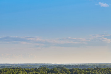 Blue aerial landscape on light background. Empty background scene. Panoramic view. Sky blue background. Urban scene. Sunny day, blue sky. Wide angle. Wide panorama. Aerial view. Sky clouds.