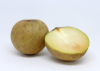 Sliced ​​exotic Sapodilla fruit on white background