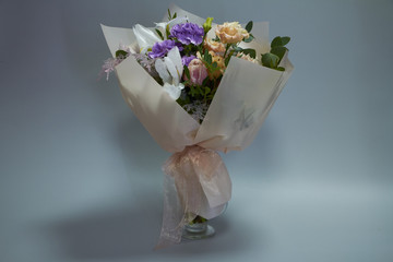 Beautiful bridal bouquet in vintage style, light gray background, selective focus