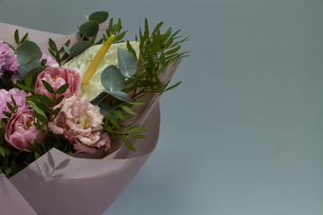 Beautiful bridal bouquet in vintage style, light gray background, selective focus