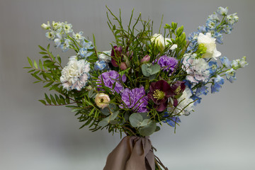 Original Provence style open bouquet, gray backdrop, selective focus