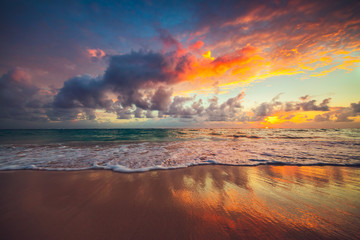 Beach sunrise over the tropical sea