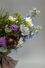 Original Provence style open bouquet, gray backdrop, selective focus