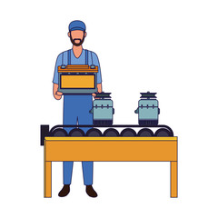 mechanic man holding a battery and car parts on transport band machine