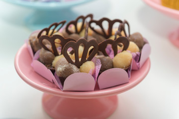 Luxury chocolate candies in a pink vintage tray.