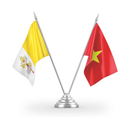 Vietnam and Vatican table flags isolated on white 3D rendering