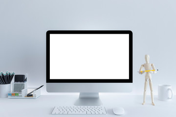 Fototapeta premium Computer with blank white copy space for text, Mockup design desktop computer in office on white table with keyboard and Coffee cub, Work place concept, Drinking glass, Cactus In pot..