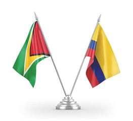 Colombia and Guyana table flags isolated on white 3D rendering