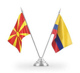 Colombia and North Macedonia table flags isolated on white 3D rendering