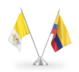 Colombia and Vatican table flags isolated on white 3D rendering