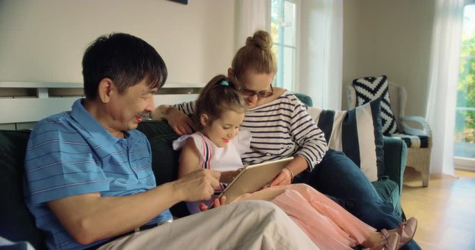 WS Grandparents Using Tablet with Granddaughter. Shot in R3D (6K RED RAW)