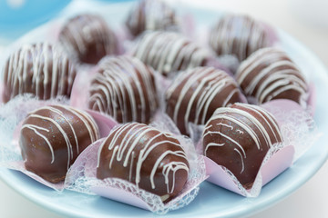 Close up of luxury pile of chocolate candies. Assorted chocolate candies.