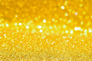 sparkles of golden glitter texture background