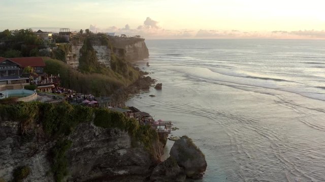 Aerial view of the famous limestone cliff of the Suluban coast during sunset in Uluwatu Bali Indonesia