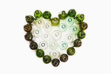empty wine bottles heart shape, white background