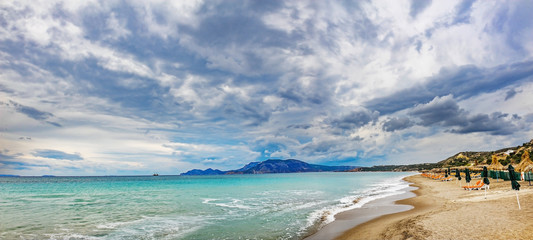 Panoramic landscape with beach and islands in horizon on sunny day