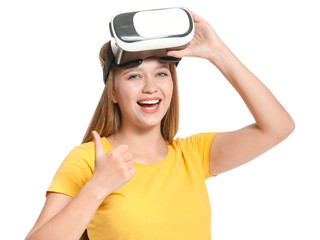 Young woman with VR glasses on white background