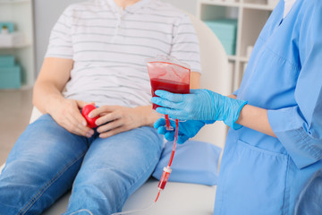 Man donating blood in hospital