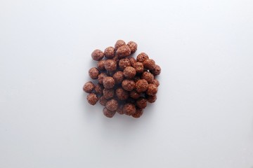 Chocolate cereal on white table 
