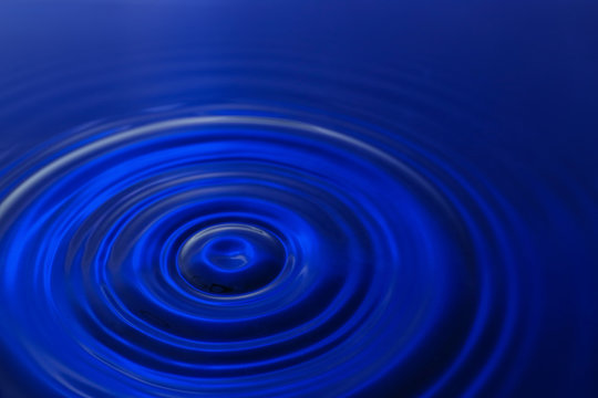 Splash of color water, closeup © Pixel-Shot