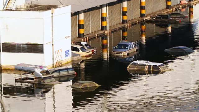 Cars swamped by Flood water, Thai flood hits Central of Thailand, Severe flooding occurred during the 2011 monsoon season in Thailand