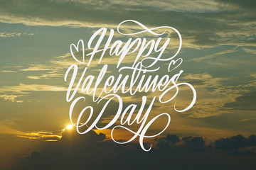 Naklejka na ściany i meble Happy valentines day big hand latter with sunset as a background
