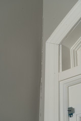 Gaps in trim molding around a door frame create unsightly cracks but are an easy DIY fix