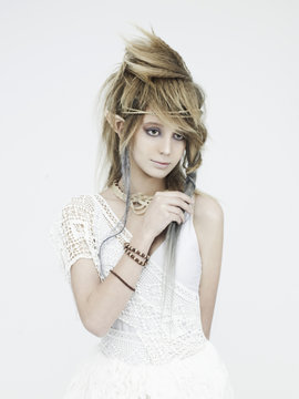Stylish picture of a beautiful young girl elf with stylish hairstyle and makeup.