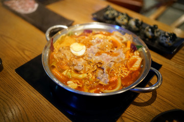 Tokpokki (Stir-fried rice cakes ) hot pot with noodles, seafood and red chili sauce, add pork and vermicelli, Traditional Korean food, The national street food of Korea.