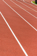 Red treadmill at stadium. Healthy and sporty lifestyles on fresh air concept