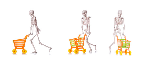Skeleton with shopping cart trolley isolated on white