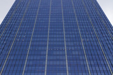 Fototapeta na wymiar Glass wall of an office building, bottom view