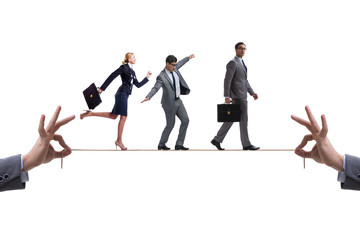 Business people walking on tight rope
