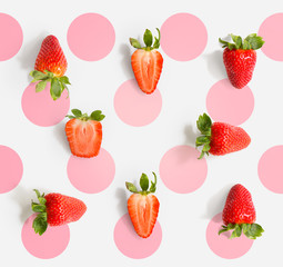 Seamless pattern with strawberry. Tropical abstract background. Strawberry on the light background with pink dots.