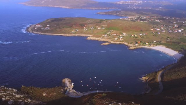 Seascape of Barizo beach on sunny day. Aerial, zoom in
