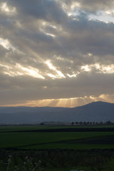 A beautifel panoramic photo of sunrise on the vally. Dramatic clouds. The sun rays.