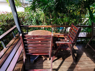Relaxing in beautiful garden with table and chairs.