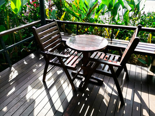 Relaxing in beautiful garden with table and chairs.