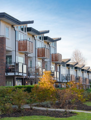Fototapeta premium Row of residential townhouses on winter day in British Columbia.