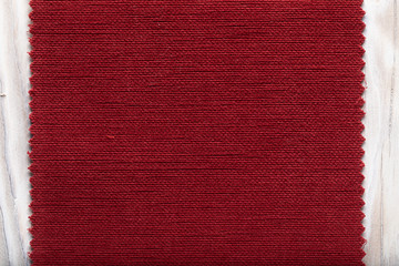 tissue structure closeup. fiber texture polyester close-up. fine grain felt red fabric background