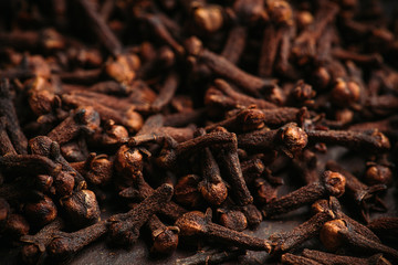 Dry cloves spices on the dark rustic background. Selective focus. shallow depth of field.