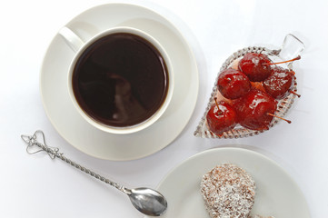 cup with spoon, apple jam in a bowl. white background.