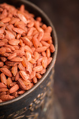 Raw red rice Dev-zira on the kitchen table. Selective focus. shallow depth of field.