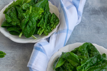 Close up view of raw spinach salad, vegetarian healthy ingredient