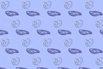 Pattern from clear plastic heart with twisted wire inside.