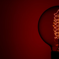 Retro Lamp on color background. Electric glow inside the lamp. Energy concept