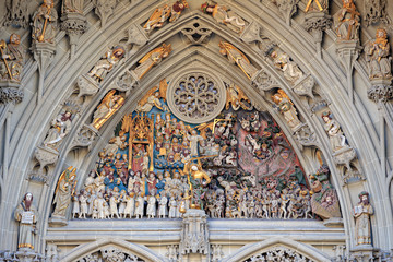 Bern, Switzerland. Portal above the entrance to Berne Cathedral..(Berner Münster). Decorated with...