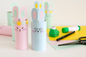 Handmade Happy Easter decorations paper bunnies from toilet paper tube, easy crafts for kids.            